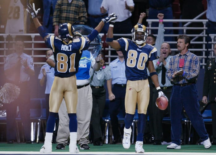 Isaac Bruce (No. 80) is perceived to be ahead of Holt in the Hall of Fame pecking order in large part due to his longevity (16 NFL seasons to Holt's 11). But in the nine seasons they played together, Holt had more receiving yards in eight of those years, and more catches in seven.